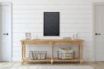 The Man in the Arena Wood Sign: White / 18” x 24”.