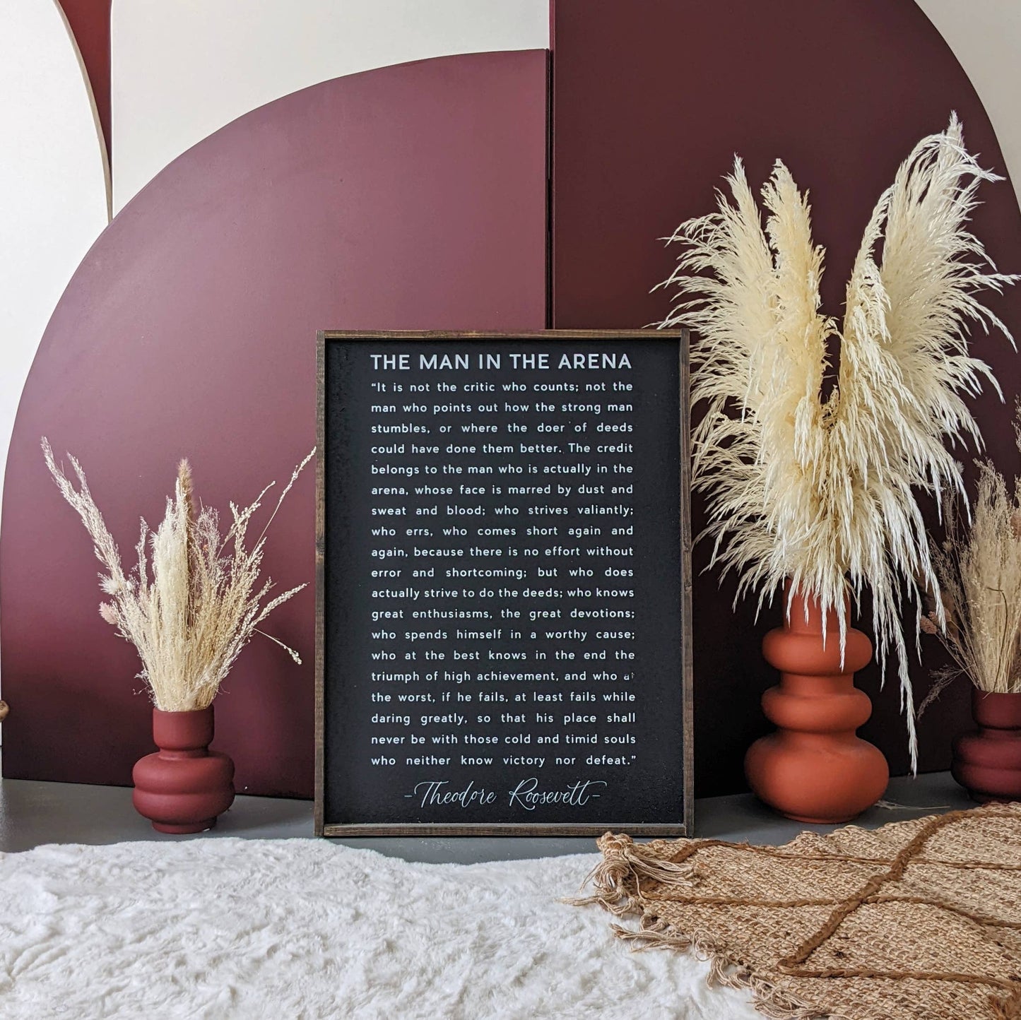 The Man in the Arena Wood Sign: White / 18” x 24”.