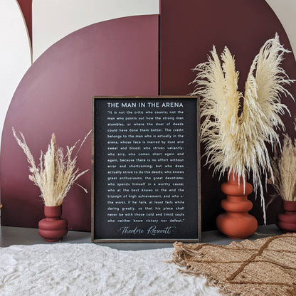 The Man in the Arena Wood Sign: White / 18” x 24”.